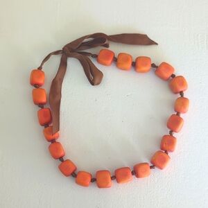 Orange Beaded Necklace with Brown Ribbon